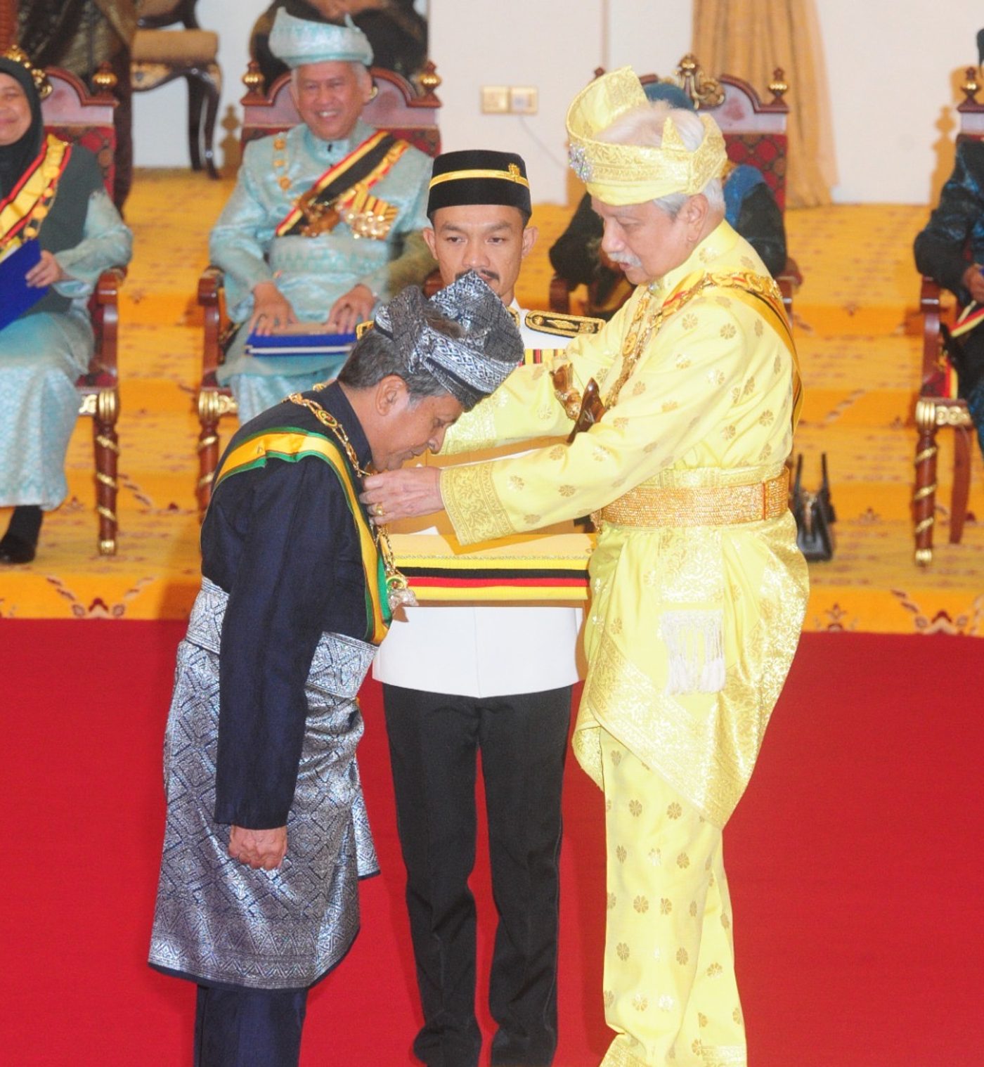 Tunku Mahmood Fawzy receiving a state honour at Istana Besar Seri Menanti